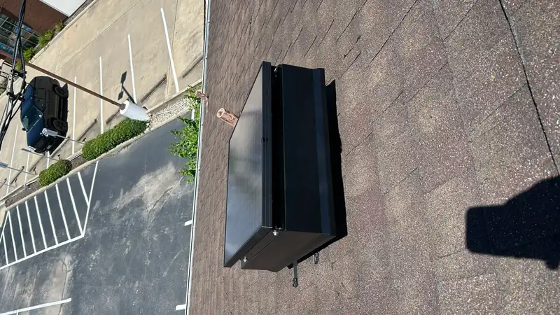 Low-profile solar attic fan installed on a residential roof