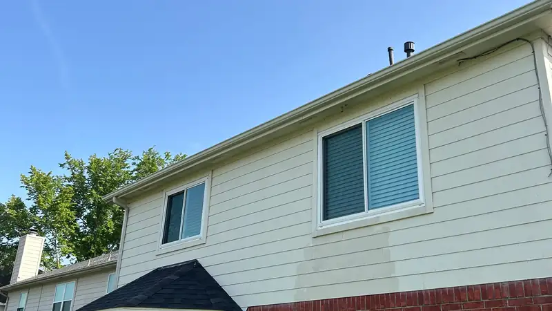 Gutter line running clean along the roof edge after the repair